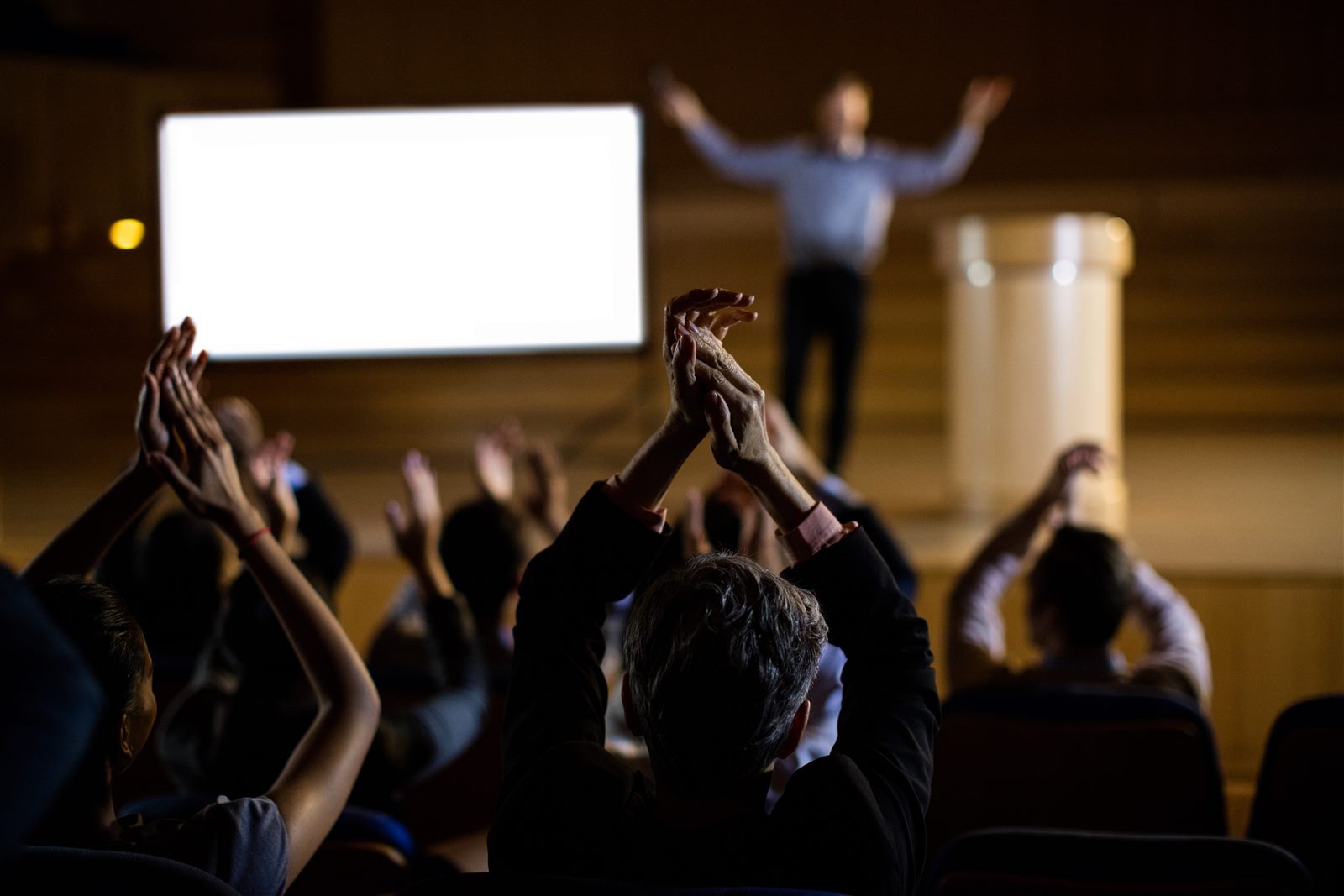 Audience engaging with a conference presentation