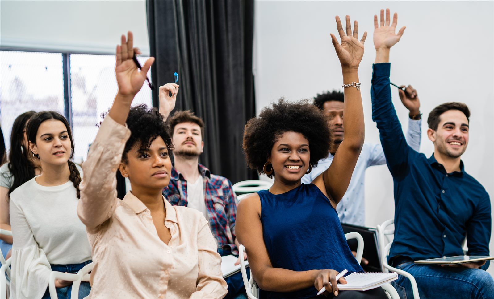 Students participating in a conference session